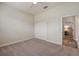 Clean bedroom with neutral walls, carpet and double closet, offering a blank canvas at 26833 Weiskopf Dr, Englewood, FL 34223