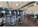 Spacious gym features high ceilings, many windows, exercise equipment, rubber flooring and bright lighting at 26833 Weiskopf Dr, Englewood, FL 34223