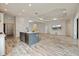 Open concept kitchen features an island, modern appliances, and ample space for entertaining at 26833 Weiskopf Dr, Englewood, FL 34223