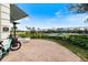 Exterior shot of a tennis pro shop with a view of a tennis court and well-kept landscaping at 26833 Weiskopf Dr, Englewood, FL 34223