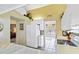Bright kitchen with white cabinetry, modern appliances, and neutral countertops at 306 Lynbrook Cir # 201, Venice, FL 34292