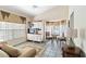 Comfortable living room with tiled floors, sofa, and a built-in entertainment center at 306 Lynbrook Cir # 201, Venice, FL 34292