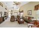 Open living room featuring high ceilings, comfortable seating, and ample space, perfect for relaxing or entertaining at 306 Lynbrook Cir # 201, Venice, FL 34292