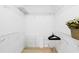 Spacious walk-in closet with built-in shelving, providing ample storage space and organization options at 306 Lynbrook Cir # 201, Venice, FL 34292