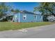 View of a single-story home featuring new solar panels and a freshly manicured lawn at 3200 Avenue A W, Bradenton, FL 34205