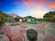 Inviting backyard with pool, dining and lounge areas, perfect for outdoor entertaining at 3228 Webber St, Sarasota, FL 34239
