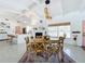 Inviting dining area with stylish furnishings and a view into the contemporary kitchen and living space at 3228 Webber St, Sarasota, FL 34239