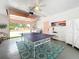 Spacious garage featuring a ping pong table, laundry area, and colorful decor at 3228 Webber St, Sarasota, FL 34239