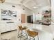 Bright kitchen with sleek countertops, modern appliances, and stylish breakfast bar seating at 3228 Webber St, Sarasota, FL 34239