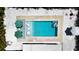 Aerial view of a modern swimming pool with stylish outdoor furniture and lush landscaping at 3228 Webber St, Sarasota, FL 34239