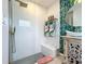 Modern shower with glass enclosure, rainfall showerhead, and a built-in bench at 3228 Webber St, Sarasota, FL 34239