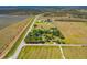 Expansive aerial view of rural property with vast land and a long road at 34200 State Road 62, Parrish, FL 34219