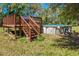 View of backyard with elevated deck, ladder, and pool at 34200 State Road 62, Parrish, FL 34219