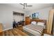 Bedroom featuring laminate floors, closet, ceiling fan, and window with view at 34200 State Road 62, Parrish, FL 34219