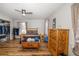 Spacious bedroom features wood-look floors, ceiling fan, and ample storage with built-in closet at 34200 State Road 62, Parrish, FL 34219