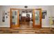 Spacious bonus room with light-filled windows and wood-look flooring at 34200 State Road 62, Parrish, FL 34219