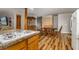 Dining area with wood table, chairs, and updated flooring at 34200 State Road 62, Parrish, FL 34219