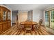 Inviting dining area with classic wooden furniture and natural light from the sliding door at 34200 State Road 62, Parrish, FL 34219