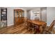Dining area featuring wood floors, a wooden table and chairs, plus a decorative hutch at 34200 State Road 62, Parrish, FL 34219