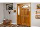 Inviting entryway featuring a double front door, wood-look flooring, and decorative wall art at 34200 State Road 62, Parrish, FL 34219