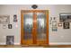 Inviting entryway featuring decorative glass doors and unique wall decor at 34200 State Road 62, Parrish, FL 34219