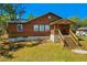 Charming two-story home with a covered front porch and well-maintained lawn at 34200 State Road 62, Parrish, FL 34219