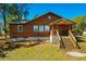Charming two-story home with a covered front porch and well-maintained lawn at 34200 State Road 62, Parrish, FL 34219