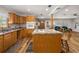 Bright kitchen featuring wooden cabinetry, granite countertops, and modern appliances at 34200 State Road 62, Parrish, FL 34219