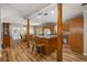 Spacious kitchen with wooden cabinets, a center island, and dining space at 34200 State Road 62, Parrish, FL 34219