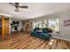 Open concept living room with luxury vinyl plank flooring and abundant light at 34200 State Road 62, Parrish, FL 34219