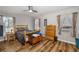 Bedroom with wood-look flooring, natural light, and a ceiling fan at 34200 State Road 62, Parrish, FL 34219