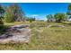 View of the vacant property showcasing a concrete foundation on a sunny day at 34200 State Road 62, Parrish, FL 34219