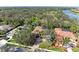 Aerial view of a home near a golf course and lake at 3751 Eagle Hammock Dr, Sarasota, FL 34240