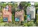 A bird's eye view of houses with red tile roofs, pools and green landscaping at 3751 Eagle Hammock Dr, Sarasota, FL 34240