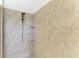 Spacious tiled shower with adjustable shower head and built in shelving at 3751 Eagle Hammock Dr, Sarasota, FL 34240