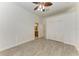 Bedroom with hardwood floors, a closet, and a view into the primary bathroom at 3751 Eagle Hammock Dr, Sarasota, FL 34240