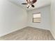 Bedroom with hardwood floors, a window with natural light, and a ceiling fan at 3751 Eagle Hammock Dr, Sarasota, FL 34240
