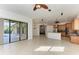 Bright kitchen overlooking pool area with wood cabinets, and tile flooring at 3751 Eagle Hammock Dr, Sarasota, FL 34240