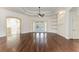 The spacious room features hardwood floors and high ceilings, offering a versatile and open living space at 3751 Eagle Hammock Dr, Sarasota, FL 34240