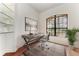 Bright office with hardwood floors, a window with natural light, and built in shelving at 3751 Eagle Hammock Dr, Sarasota, FL 34240