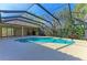 Bright, screened-in pool and patio with an uniquely shaped pool, ideal for outdoor enjoyment and relaxation at 3751 Eagle Hammock Dr, Sarasota, FL 34240