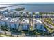 Stunning aerial view of waterfront condominiums with beautiful landscaping and water views in a coastal community at 383 Aruba Cir # 102, Bradenton, FL 34209