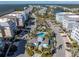 Aerial view of a condo community with multiple buildings surrounding a pool, clubhouse, and other amenities at 383 Aruba Cir # 102, Bradenton, FL 34209