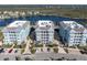 Drone shot of bayfront condominiums with dedicated parking and easy access to nearby waterways and beaches at 383 Aruba Cir # 102, Bradenton, FL 34209