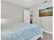 Bright bedroom featuring a flat screen TV and doorway leading to the dining area at 383 Aruba Cir # 102, Bradenton, FL 34209