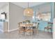 Dining area features a round table and wooden chairs with decor at 383 Aruba Cir # 102, Bradenton, FL 34209