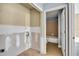 Unfinished bathroom with drywall, tiled floors, and doorway to completed bathroom at 4008 Crockers Lake Blvd # 13, Sarasota, FL 34238