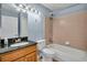 Finished full bathroom with shower, toilet, granite countertop sink and vanity at 4008 Crockers Lake Blvd # 13, Sarasota, FL 34238