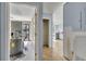 A view through a hallway with a washer dryer and into a kitchen at 4008 Crockers Lake Blvd # 13, Sarasota, FL 34238
