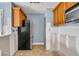 Partially renovated kitchen featuring wooden cabinets and modern appliances, ready for customization at 4008 Crockers Lake Blvd # 13, Sarasota, FL 34238